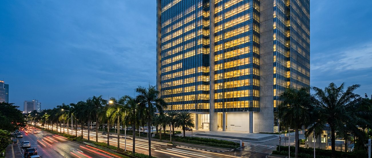 A Jakarta office tower on Jl. Jenderal Gatot Subroto at dusk